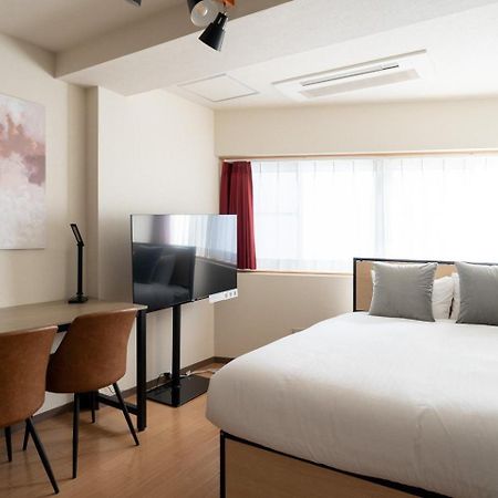 Апартаменты Shinjuku Okada Building Токио Экстерьер фото